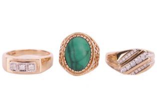 A collection of three 9ct yellow gold rings comprising a malachite-set dress ring, the malachite cab