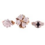 Three gem-set rings, comprising a 9ct yellow gold diamond-set flower head ring, size O, a floral clu