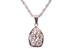 A diamond pendant necklace, featuring a cluster of old cut diamonds with a total estimated diamond w