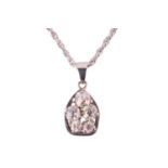 A diamond pendant necklace, featuring a cluster of old cut diamonds with a total estimated diamond w