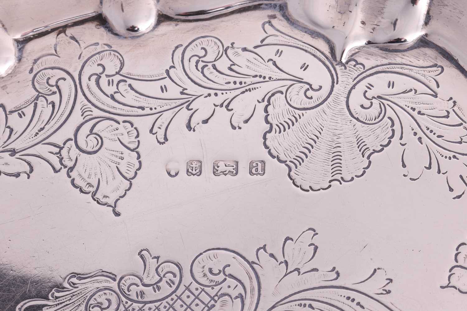 A Victorian silver salver, circular with raised scroll and foliate border and flat chasing to centre - Image 6 of 13