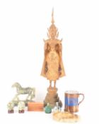 A mixed collection comprising a Thai gilt standing Buddha, an ashtray modeled to appear like a disk 