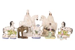 A collection of Staffordshire and in the style of Staffordshire figurines to include a large pair on