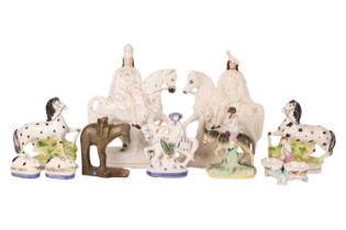 A collection of Staffordshire and in the style of Staffordshire figurines to include a large pair on