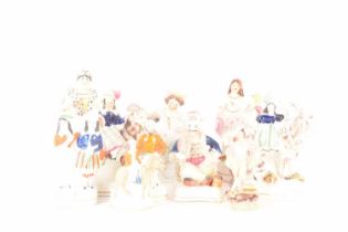 A collection of ten Staffordshire and Staffordshire style miniature figures, the largest measuring