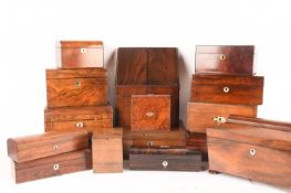 A large collection of wooden boxes comprising a knife box, two tea caddies, a writing box, a box con