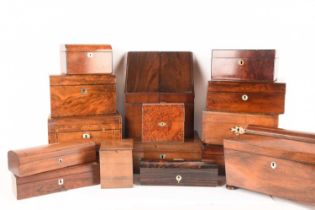 A large collection of wooden boxes comprising a knife box, two tea caddies, a writing box, a box