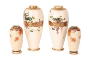 Two graduated pairs of Meiji period Japanese Satsuma vases, decorated with a wisteria motif, the