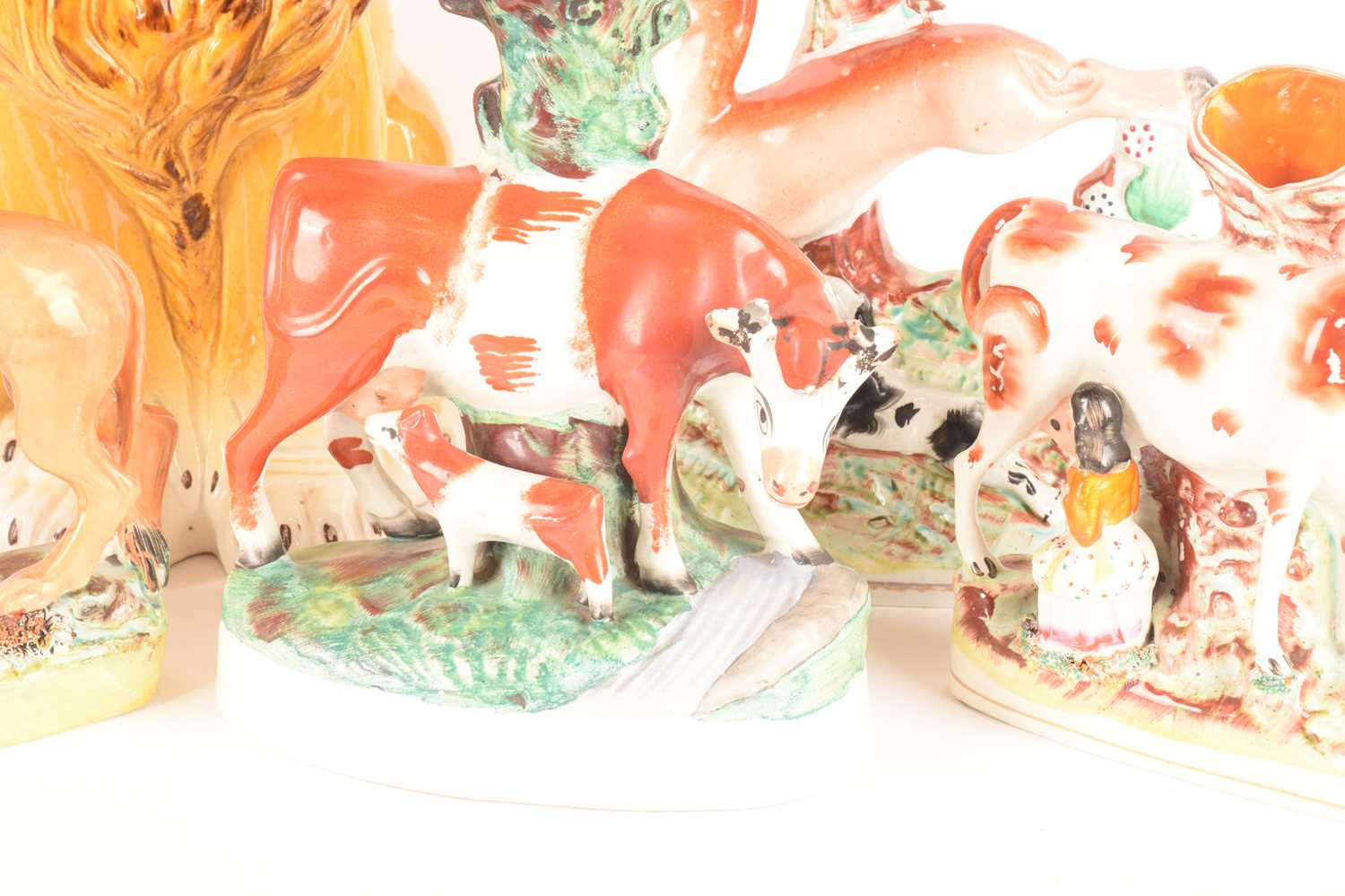 A collection of late 19th-century Staffordshire and Staffordshire style spill vases comprising a cow - Image 6 of 9