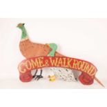 A group of 20th-century Folk art hand-painted carnival decorations comprising a large pheasant, a ma