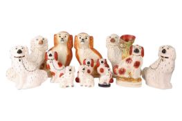 A collection of five pairs of the classic Staffordshire and Staffordshire style King Charles dog fig