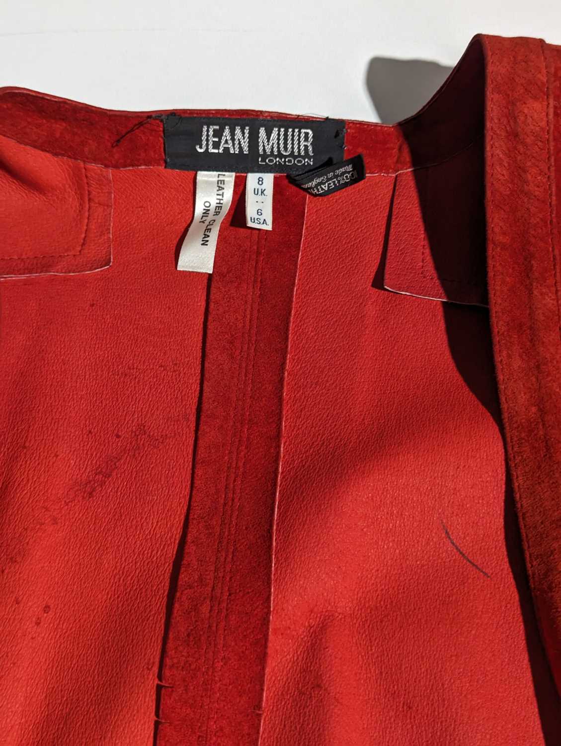 Jean Muir - an oversized bright red suede leather jacket with side pockets, size UK8; a black rayon  - Image 17 of 17