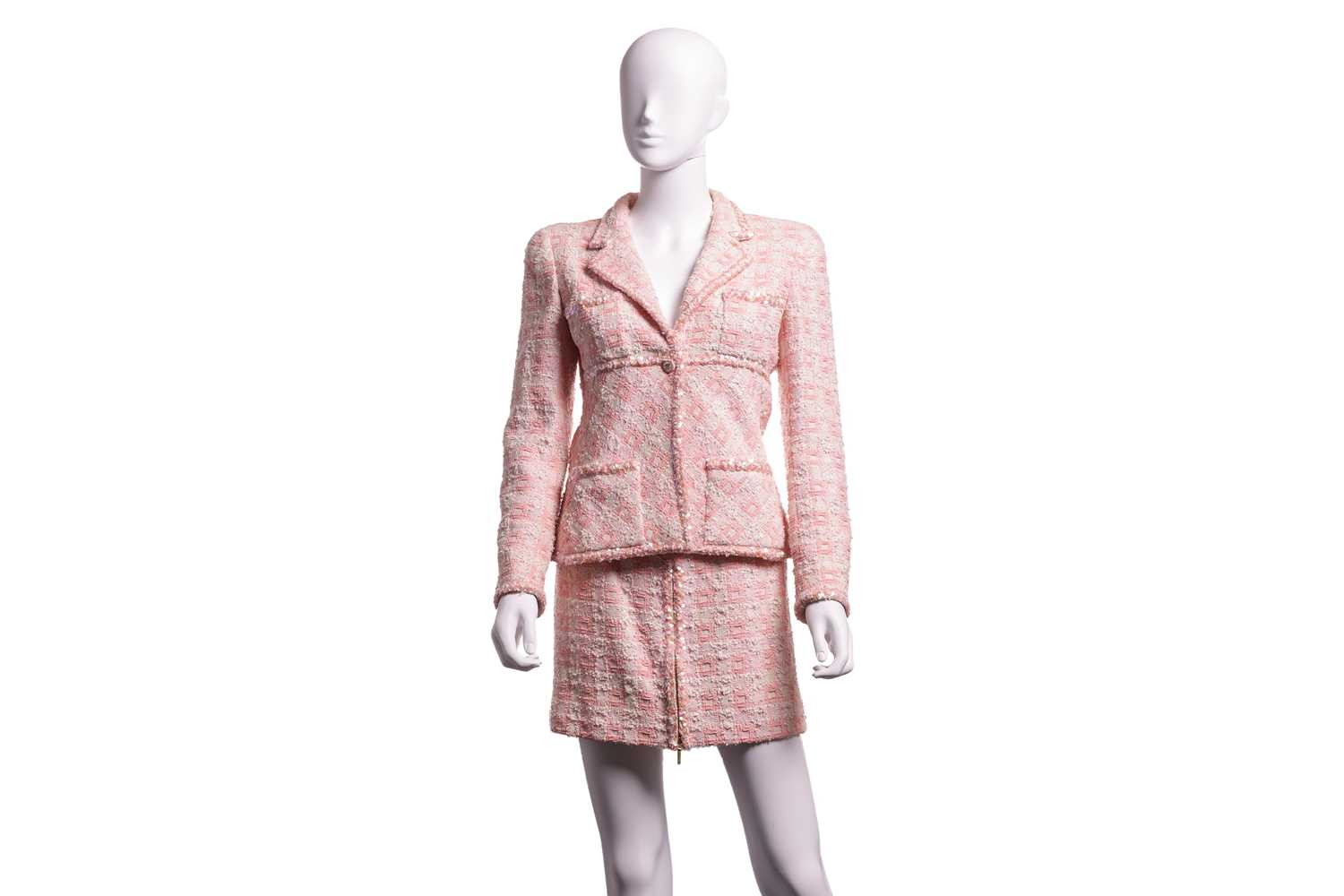 Chanel - a two-piece suit in peachy-pink tweed, from 1995 Spring and Summer ready-to-wear collection