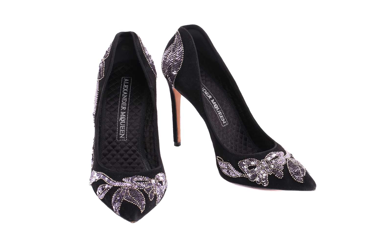 Three pairs of shoes; a pair of Alexander McQueen pointed-toe high heels in black suede with silver 