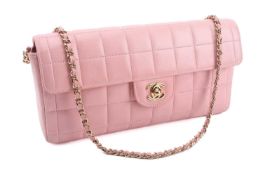Chanel - an East West Chocolate Bar bag in baby pink lambskin leather, elongated rectangular body wi