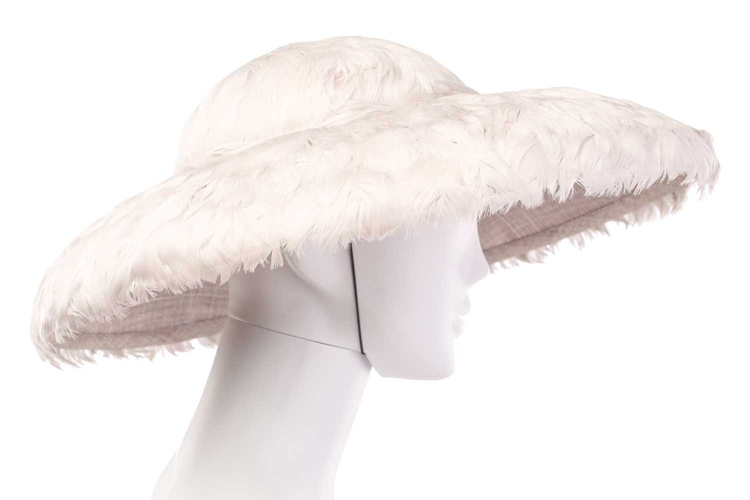 A collection of three hats; including a Philip Treacy fascinator with grey falling feathers around t - Image 16 of 17