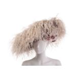 A collection of three hats; including a Philip Treacy fascinator with grey falling feathers around t