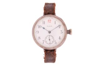 A 1914 Elgin keyless wound trench watch, featuring a white face with Arabic numerals in a silver