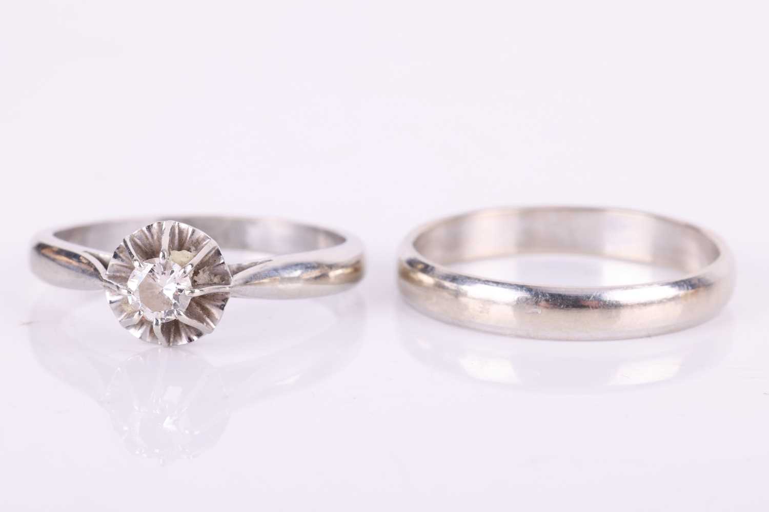 A diamond-set solitaire ring and matching wedding band; the illusion-set round brilliant diamond mea - Image 2 of 7