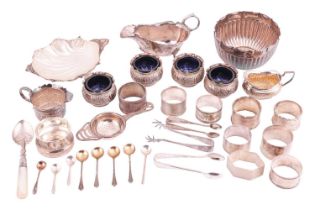 A collection of mixed silver items; to include a set of four glass-lined salt cellars with