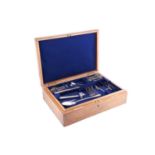 A group of mixed silver flatware and a plated bone holder in an oak canteen case; to include: 6x fid