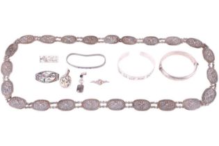 A collection of jewellery, including a hallmarked silver bangle with engraved decoration, weighing