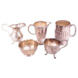 A small collection of 20th-century silver, comprising two cream jugs, a milk jug, a beaker and a bon