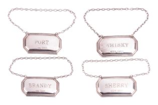 A set of four decanter labels; sherry, whiskey, brandy and port, each measuring 5.2 x 2.8mm, with