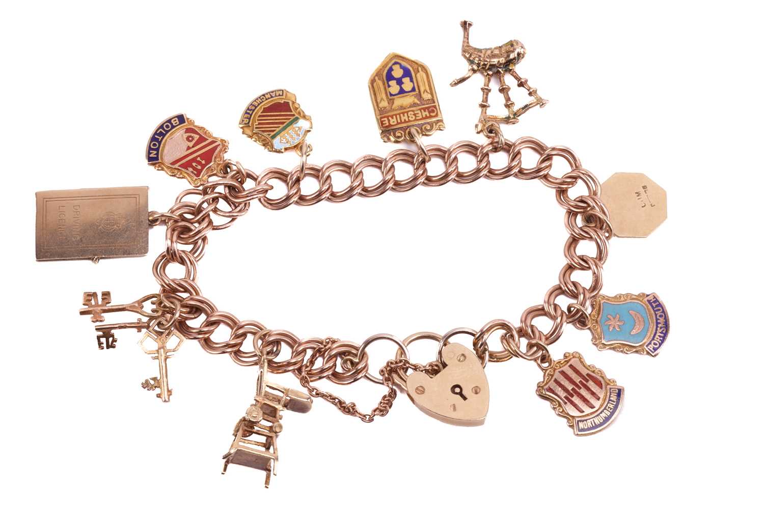 A 9ct gold charm bracelet featuring ten charms including a highchair, a set of three keys, a hinged 