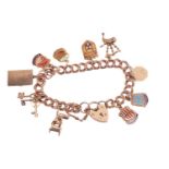 A 9ct gold charm bracelet featuring ten charms including a highchair, a set of three keys, a hinged 