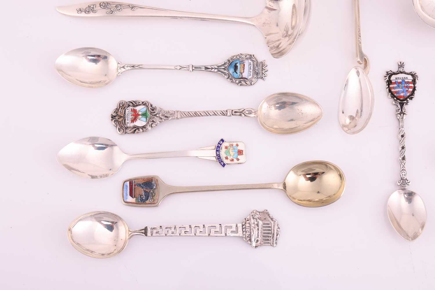 A small group of assorted souvenir spoons with enamel finials; and a set of six cordial glasses in w - Image 2 of 9