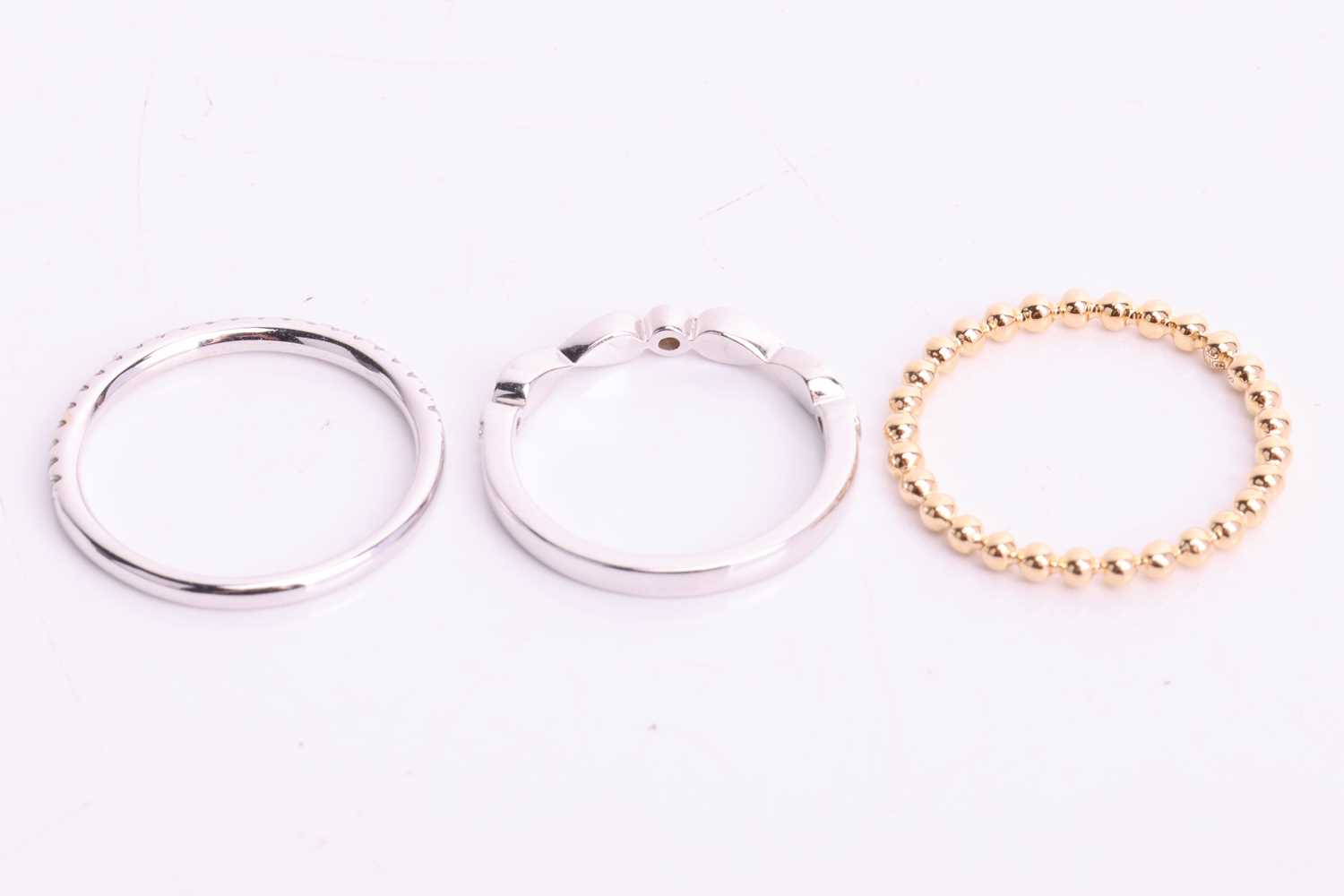 Three 18ct gold rings; to include a beaded design thin wedding band in 18ct yellow gold, size M; a d - Image 4 of 4