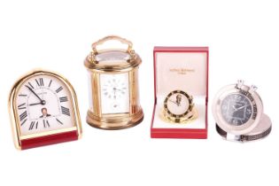 A collection of four travel clocks. Featuring two Cartier clocks, an Arthus Bertrand Paris and an L'