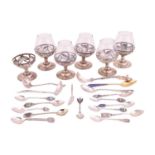 A small group of assorted souvenir spoons with enamel finials; and a set of six cordial glasses in w