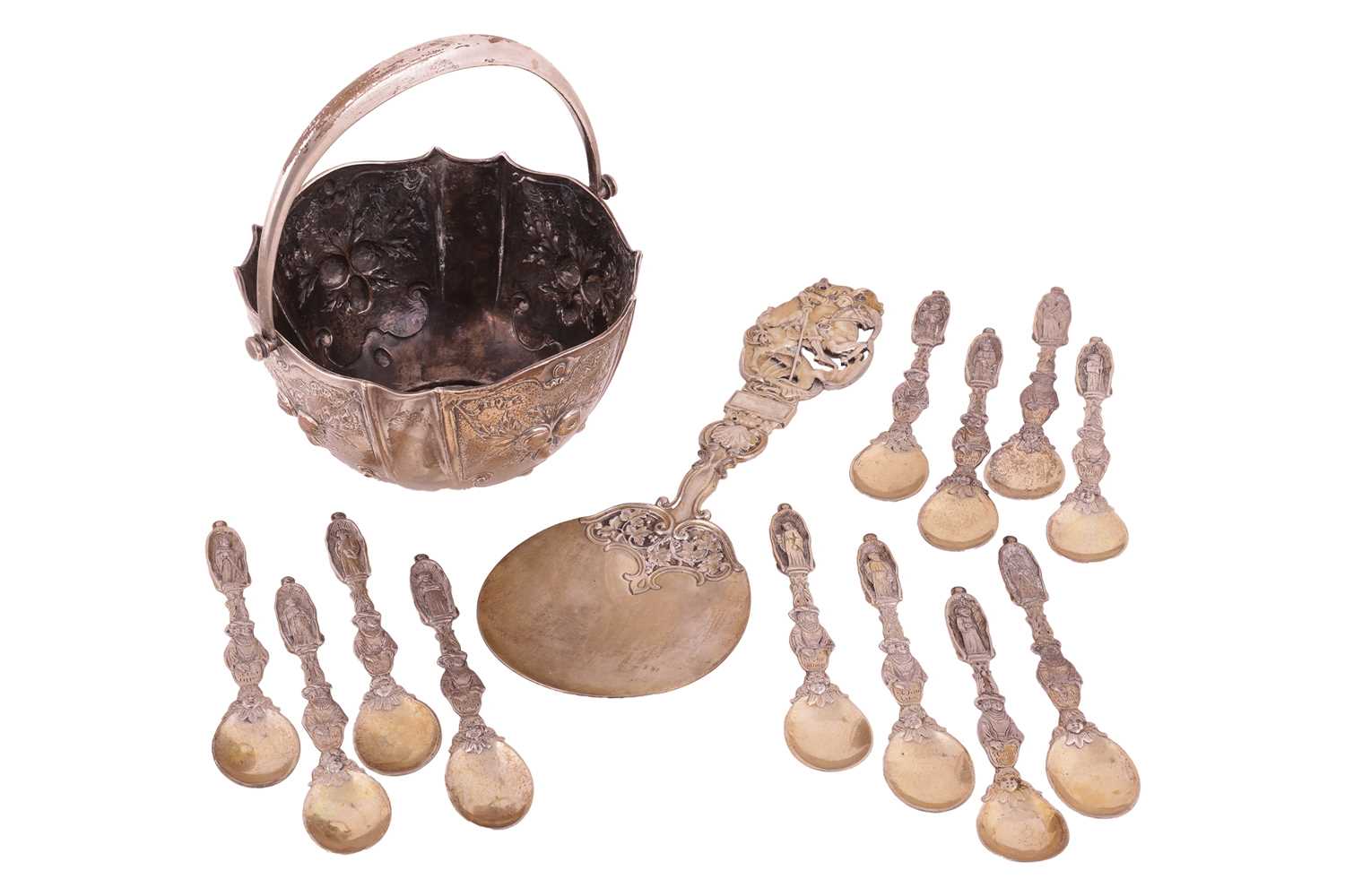 A group of Continental white metal items; to include a set of twelve Apostle teaspoons with differen