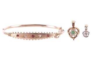 A collection of three items of jewellery, including a diamond single stone pendant, set with a round