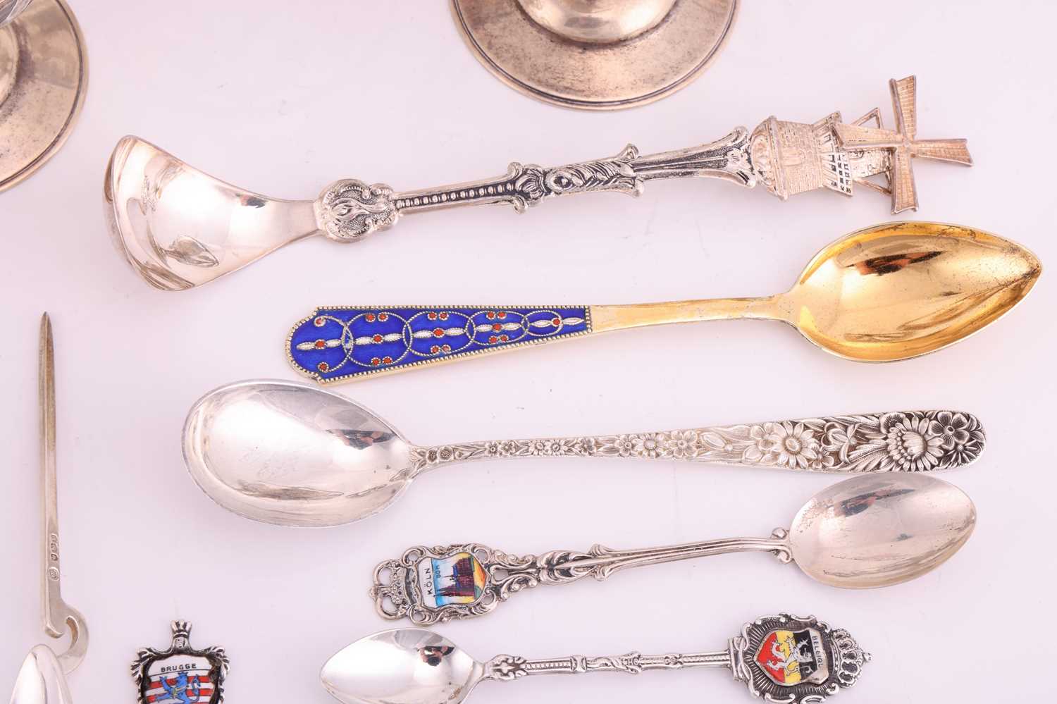 A small group of assorted souvenir spoons with enamel finials; and a set of six cordial glasses in w - Image 5 of 9
