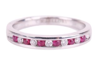 A ruby and diamond half-eternity ring in 18ct white gold, channel-set with alternating circular-