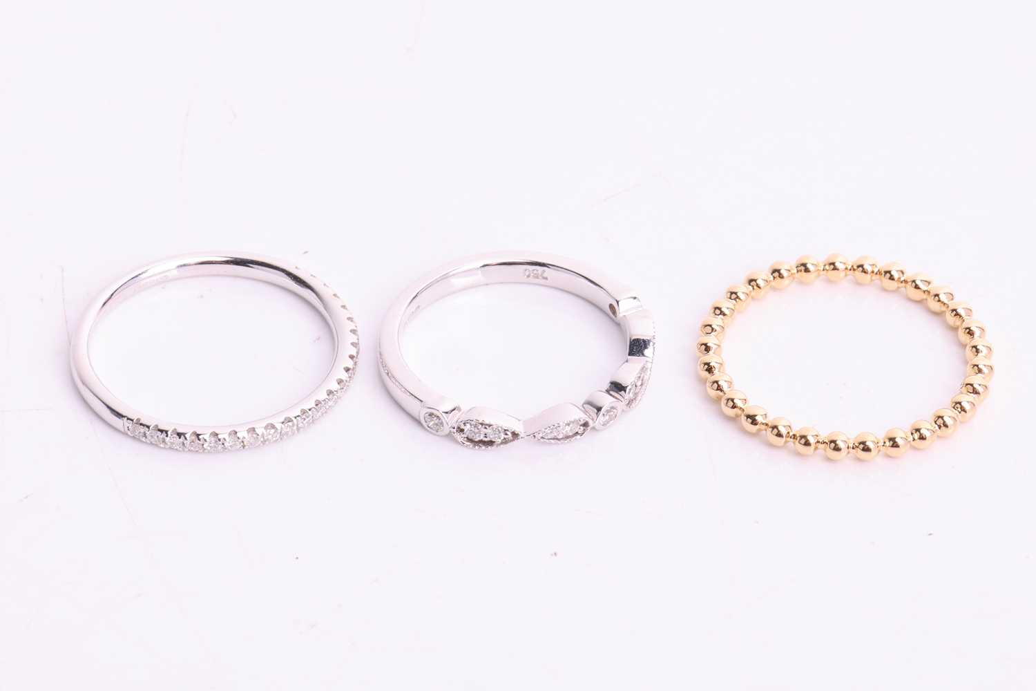 Three 18ct gold rings; to include a beaded design thin wedding band in 18ct yellow gold, size M; a d - Image 3 of 4