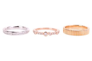 Three 18ct gold rings; to include a diamond-set dress ring in 18ct rose gold, size L; a channel-