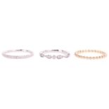 Three 18ct gold rings; to include a beaded design thin wedding band in 18ct yellow gold, size M; a d