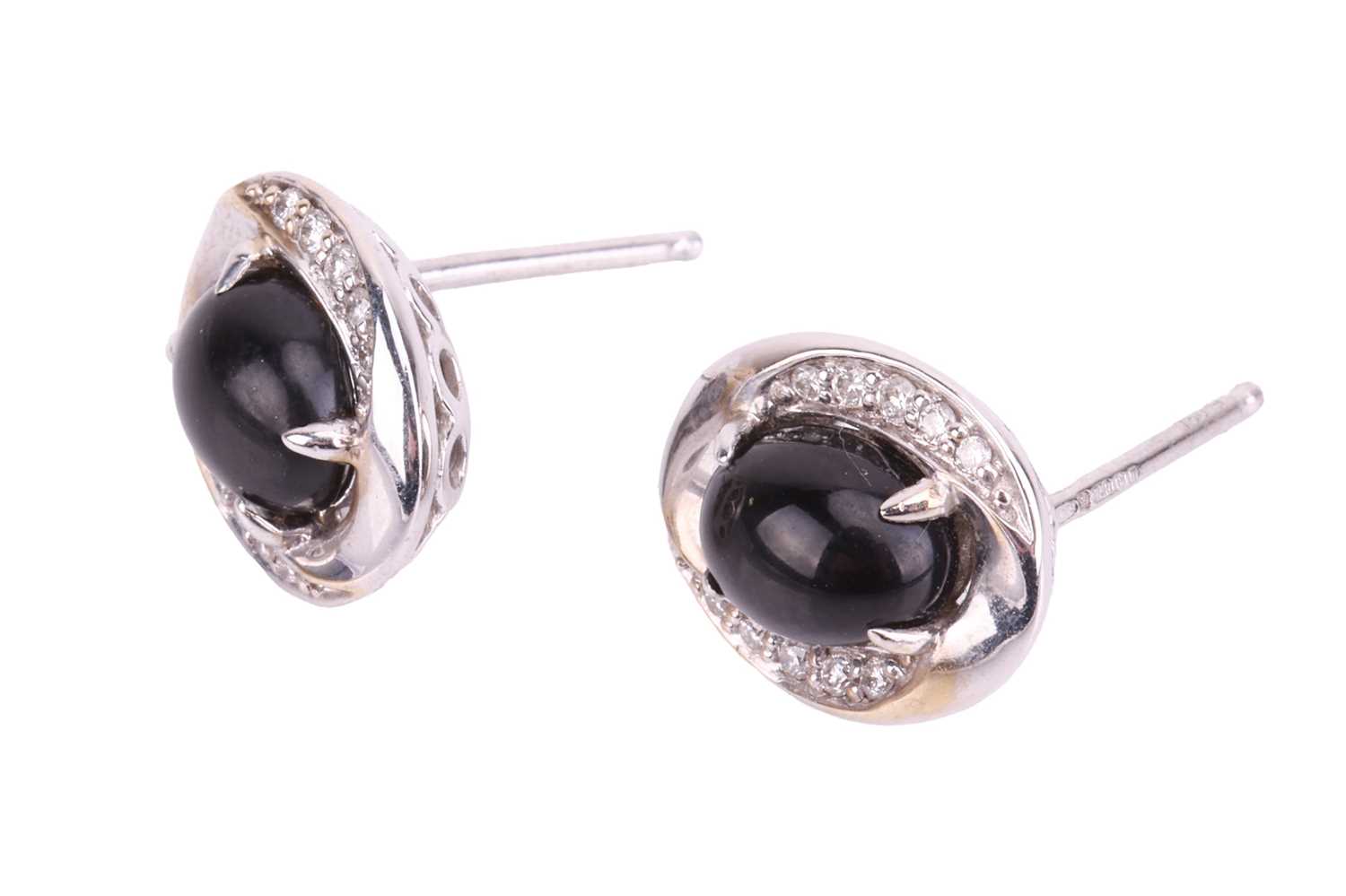 A pair of Whitby jet and diamond stud earrings in 18ct white gold, each containing an oval jet caboc - Image 3 of 3