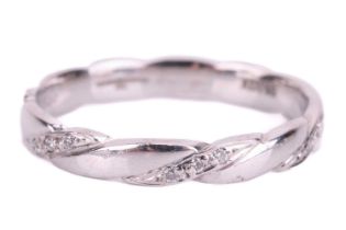 A diamond-set wedding band in 18ct white gold, of twisted design, with alternating segments