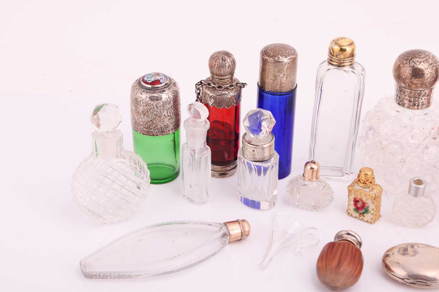 A collection of cut glass scent bottles, many with silver mounts, one featuring an enamel portrait c - Image 2 of 5