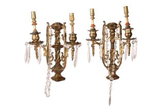 A pair Neo neo-classical gilt brass two-sconce wall lights with central columns, each branch with