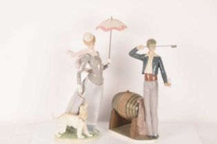 Lladro: A pair of figurines comprising The Wine Taster (5239) and Lady with a Shawl (4914), the