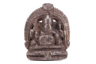 An Indian hardstone carved figure of Ganesh sitting on a double lotus socle, 20th-century,