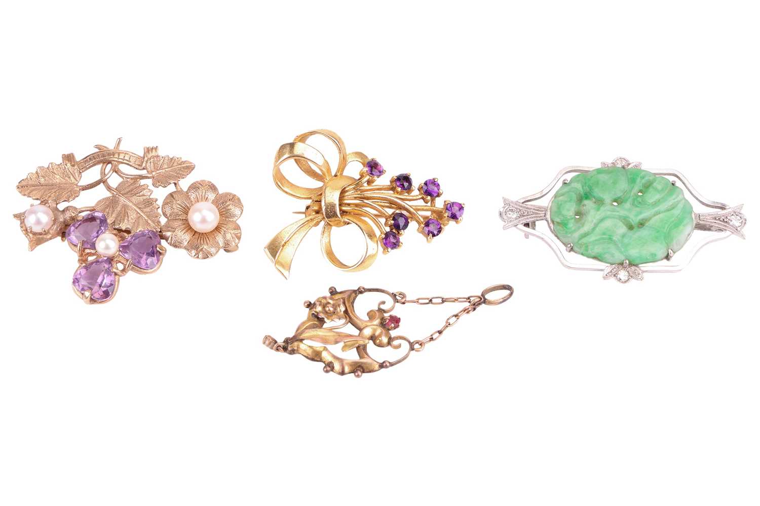 Three gem-set brooches and a pendant; to include a carved jadeite brooch, claw-set in an open-work l