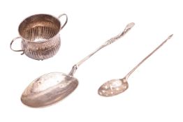 An early 18th century miniature porringer with a spirally reeded body below a foliate punched band, 