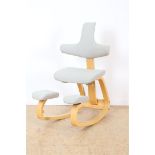 Ergonomic desk/knee chair with cream upholstery, design Peter Opsvik for Stokke, model Varier,